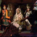 American Indian dancers perform during dinner in the longhouse at Tillicum 