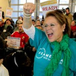 Immigrants and advocates on a multicity bus tour across the state calling for immigration reform hold a rally Wednesday at Casa Latina in Seattle. Lupe Sanchez, at right, from Yakima cheers with the crowd. Photo: Mark Harrison/The Seattle Times