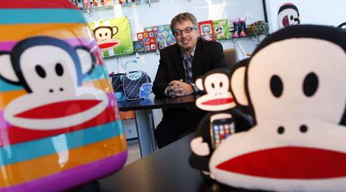 Paul Frank parent company Saban Brands President Elie Dekel surrounded by products featuring Paul Frank icon Julius the Monkey. (Genaro Molina / Los Angeles Times / June 19, 2013)