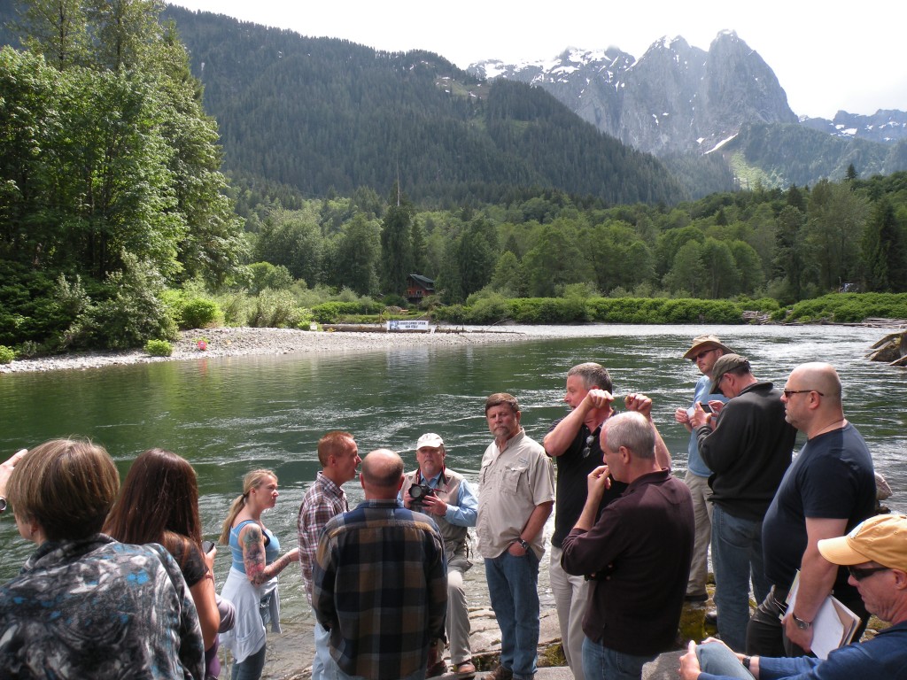 Jeff Smith (center, in tan shirt) welcomed a public tour by FERC and the PUD at his property, which borders on the proposed dam site.Bellamy Pailthorp / KPLU News