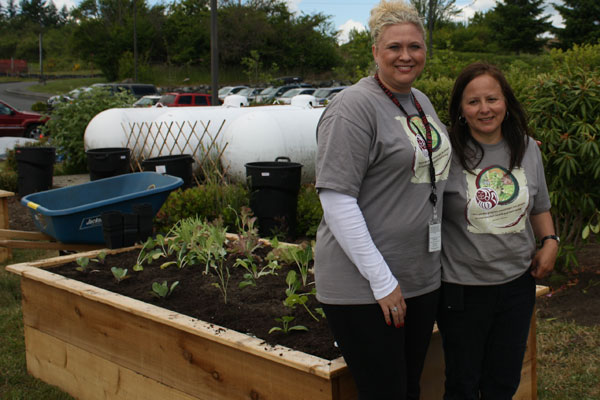 Monica Hauser (left), diabetes educator and Veronia Leahy, diabetes program coordinator at the Tulalip Health Clinic, at the site of the newly opened health clinic garden on June 11. 