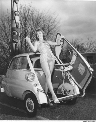 Richards Studio Collection : On March 11, 1958, Miss Tacoma Home Show of 1958, Marilyn Ganes, was photographed leaning out of the front door of a BMW Isetta 300 parked near the Tacoma Totem Pole.