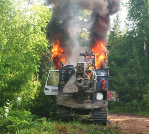 Shot-hole driller ablaze down the Bass River road. Photo: Miles Howe