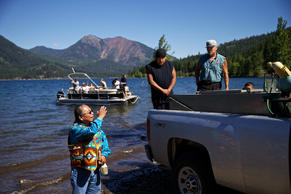 LAKE CLE ELUM, WASHINGTON - Jun. 13, 2013 - Tribal Council Member Gerald Lewis conduct a blessing ceremony before releasing sockeye salmon into the lake, Wednesday, July 10, 2013, to mark the first return of sockeye salmon to Lake Cle Elum in 100 years. Sockeye salmon were reintroduced to the lake in 2009 by the Yakama Nation and the fish released today are the first of those salmon to return to the lake. Thomas Boyd/The Oregonian 