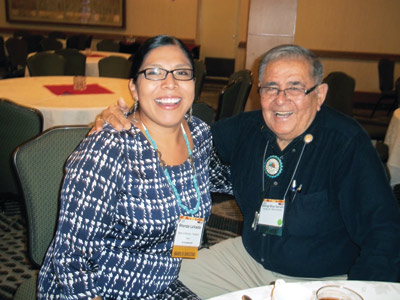 Native American Journalists Associaiton President Rhonda LeValdo speaks with Dr. George Blue Spruce about the state of dentistry in Indian country. Photo/Stan Bindell