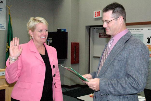 Kirk BoxleitnerDr. Becky Berg is sworn in as superintendent of the Marysville School District by Marysville School Board President Chris Nation on July 8