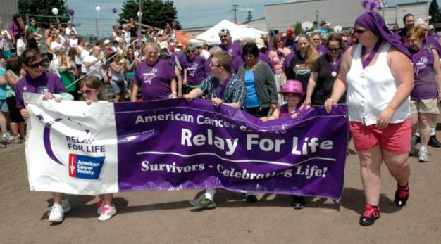Kirk BoxleitnerCancer survivors kick off the 2013 Marysville Tulalip/Relay For Life with the opening lap at Asbery Field on June 29.
