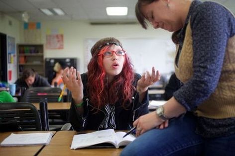 Mark Mulligan / The HeraldVanessa Miller, 22, questions instructor Jennifer Jennings during her GED class Thursday at Everett Community College.