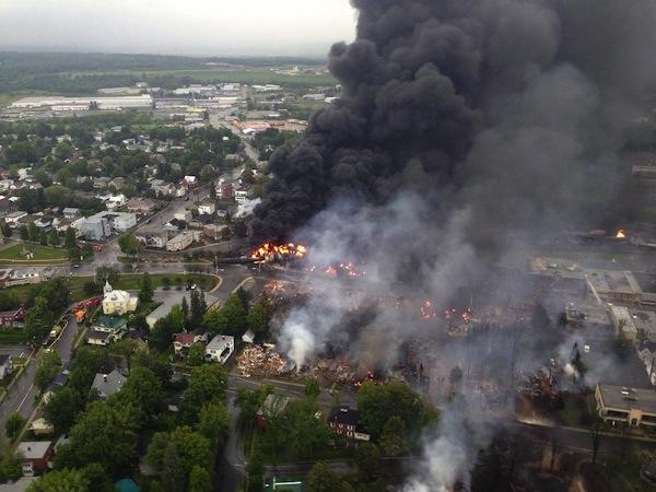  Fire rages the day after a 73-car train carrying crude oil from the Bakken shale of North Dakota to refineries in New Brunswick, Canada, burn after the train got loose and smashed into the town of Lac-Mégantic, killing 47.
