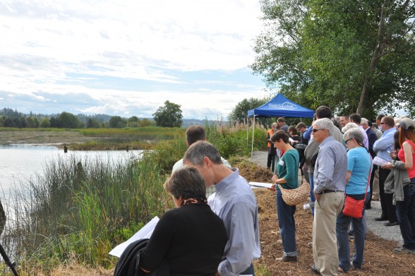State and local politicians along with environmentalists toured the estuary while learning about the extensive undertakings that are part of the complex project that will restore the estuary to it's natural function. Photo by Monica Brown