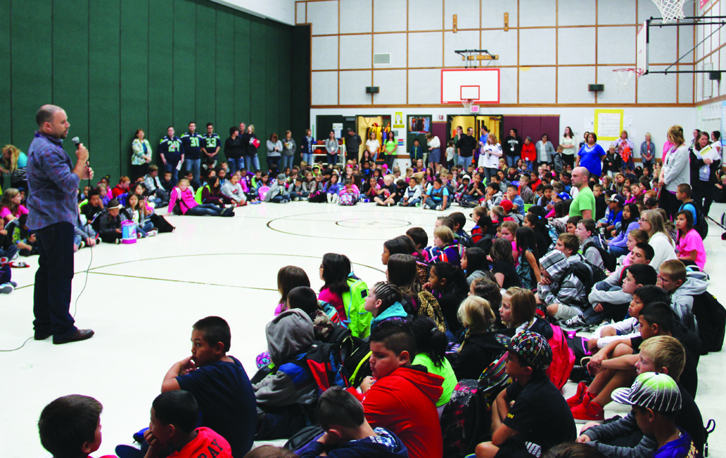 At Tulalip Quil Ceda Elementary, each day is begun with a song and a presentation of core Tulalip cultural values. Photo/Andrew Gobin