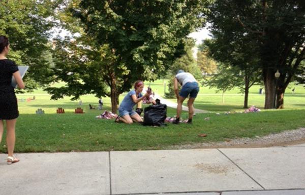 source: middbeat.org, Rachel KoganProtesters removing commemorative 9/11 flags from the Middlebury campus lawn.