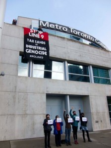 Banner drop in front the of Metro Convention Centre, where the NEB hearings are taking place this week in Toronto. Photo: Michael Toledano