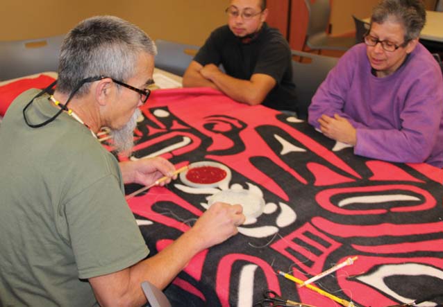 Richard Muir Jr. holds a beading seminar for Veterans Day at Hibulb. He is demonstrating the technique called Peyote Stitch.Photo: Andrew Gobin, Tulalip News