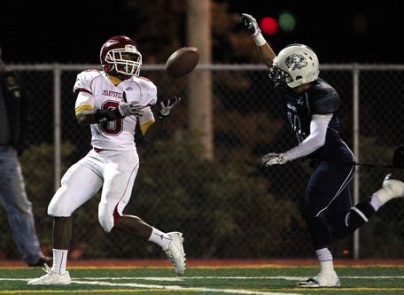 Jennifer Buchanan / The HeraldMarysville-Pilchuck wide receiver Chris Jones catches a long touchdown pass in front of Glacier Peak's Austin Hines during Friday night's game.