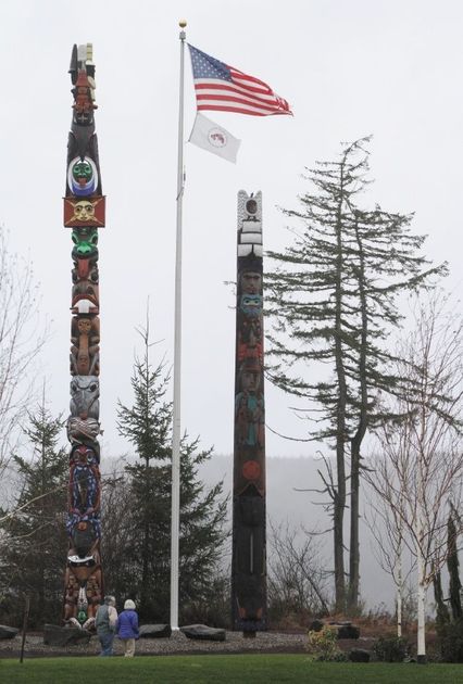 A welcome pole, right, originally carved for the Port of Olympia 15 years ago, has found a home at the Salish Cliffs Golf Course on the Squaxin Island Indian Reservation, shown Friday.TONY OVERMAN/STAFF PHOTOGRAPHERRead more here: http://www.theolympian.com/2014/01/12/2926674/benighted-totem-pole-finds-a-home.html#storylink=cpy
