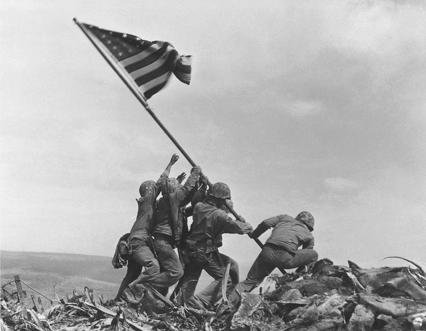     In a file photo U.S. Marines of the 28th Regiment of the Fifth Division raise the American flag atop Mt. Suribachi, Iwo Jima, on Feb. 23, 1945. Joe Rosenthal, who won a Pulitzer Prize for his immortal image of six World War II servicemen raising an American flag over battle-scarred Iwo Jima, died Sunday. He was 94.