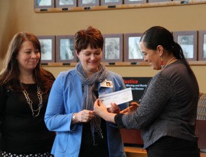 Tulalip Tribes vice-chairwoman Deborah Parker presents a donation check in the amount of $50,000 to Heather Logan of the Cascade Valley Hospital Health Foundation. The donation will be used for the Oso, WA mudslide victims' fund.Photo/ Brandi N. Montreuil, Tulalip News 