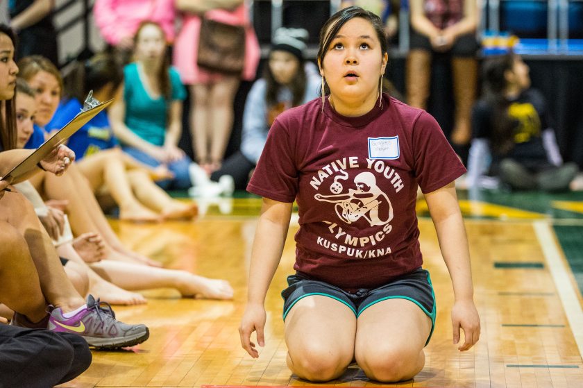 Georgette Morgan gets ready to compete in the kneel jump. Nearly 500 student athletes from across Alaska are in Anchorage this week to compete in the 44th annual Native Youth Olympics. Apr 24, 2014Loren Holmes photo