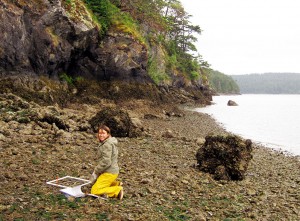 Tiffany Hoyopatubbi, water resources specialist, uses a quadrat to sample shellfish species on the beach on Kukutali Preserve