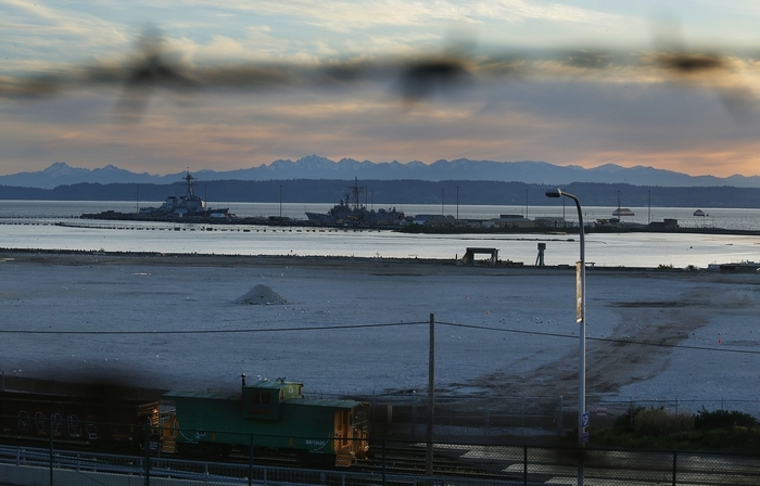 Mark Mulligan / The HeraldBarbed wire surrounds Kimberly-Clark's now vacant property along the Everett waterfront during sunset Wednesday evening. A proposed deal to sell the property to Saltchuck has fallen apart, both companies announced Wednesday.