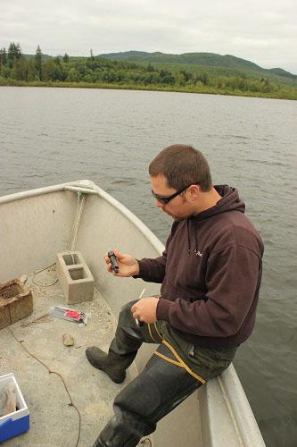 Joe Puhn, Squaxin natural resources technician, prepares temperature gauges.