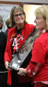 Marysville-Pilchuck High School Interim Assistant Principal Lori Stolee and Interim Co-Principal Deann Anguiano take possession of the dreamcatcher, Monday, Nov. 3, 2014, at Marysville School Board District office. (Tulalip News Photo/ Brandi N. Montreuil)