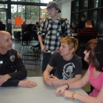 From left, Marysville Police School Resource Officer Dave White takes a moment during lunch at Marysville Getchell High School to chat with students Dalton Adcock, Curtis Combs and Bionca Perez. Photo: Kirk Boxleitner.