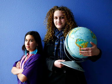 Erika Schultz / The Seattle TimesSixth-grader Aimee Coronado, 12, left, and ninth-grader Emily Barrick, 15, have been fundraising for local and international causes at Federal Way Public Academy and will attend We Day on Wednesday. The event, held in Canada, makes its U.S. debut at KeyArena. 