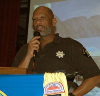 Kirk BoxleitnerBrian Taylor, a detective with the SeaTac Police Department, urges parents at the Marysville-Pilchuck High School auditorium to monitor their children’s online activity to prevent them from being victimized.