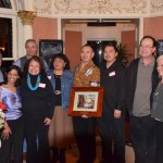 Colville Confederated Tribes Chairman John Sirois, center (holding award plaque), and previous Watershed Hero Award recipient Mary Verner pose with tribal members at Sierra Club award dinner. Colville received the 2013 Watershed Hero Award from the Sierra Club's Washington chapter. Photo: Jack McNeel.