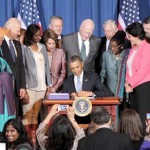 Diane Millich (Southern Ute Indian Tribe) (second to left) and Deborah Parker (Tulalip Tribe) (third to left) joined President Barack Obama and Vice President Joe Biden, members of the administration and Congress, women's rights advocates, and domestic abuse survivors for the signing of the Violence Against Women Act (VAWA) reauthorization on March 7. Courtesy National Congress of American Indians
