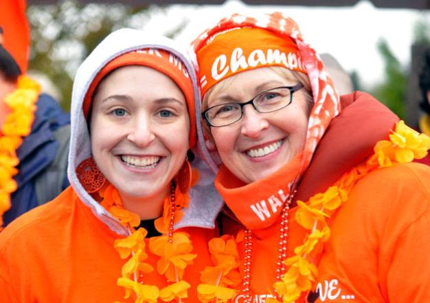 Lauren SalcedoSamantha Love, left, and Linda Goldberg smile as they prepare to complete the Snohomish County Walk MS at the Tulalip Amphitheatre on Saturday, April 13.