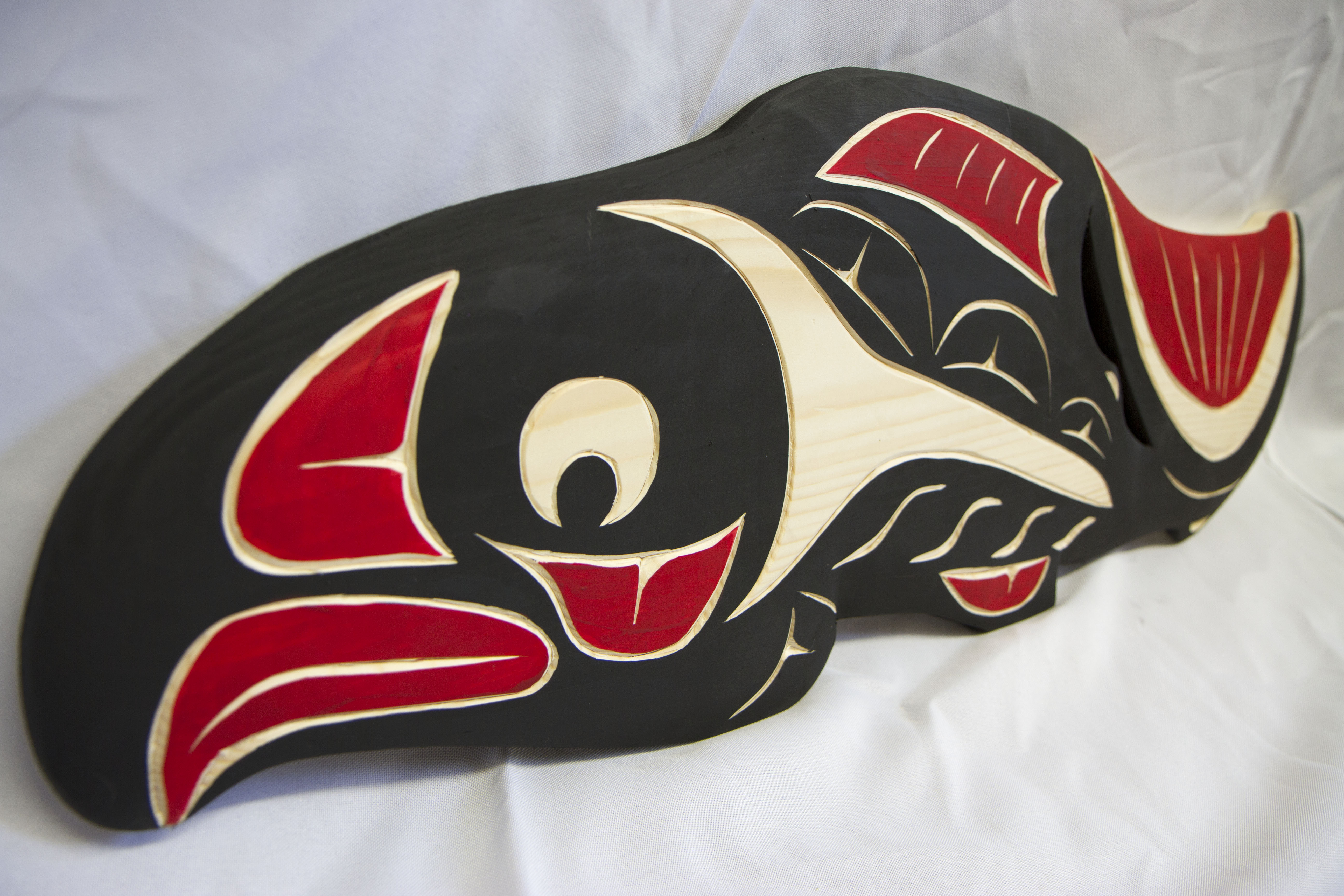 Coast Salish artists are the backbone of the TL’aneq’ fundraiser. Art, including this carving by Steven Charlie of the Squamish Nation, is donated by the artists each year and all of the profits help support a selected NWIC project or program. This year, all funds raised will go toward scholarships for NWIC students. Photo courtesy of NWIC