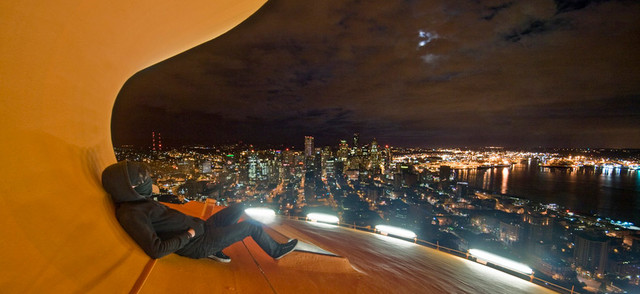 An unidentified climber sits atop the roof of the Space Needle in Seattle.Photo by Reddit/Shuttersubversive