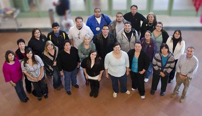 The 22 members of the first graduating class from the Master of Tribal Administration and Governance program at University of Minnesota - Duluth include three tribal executive directors from Minnesota. (Photo courtesy of University of Minnesota - Duluth)