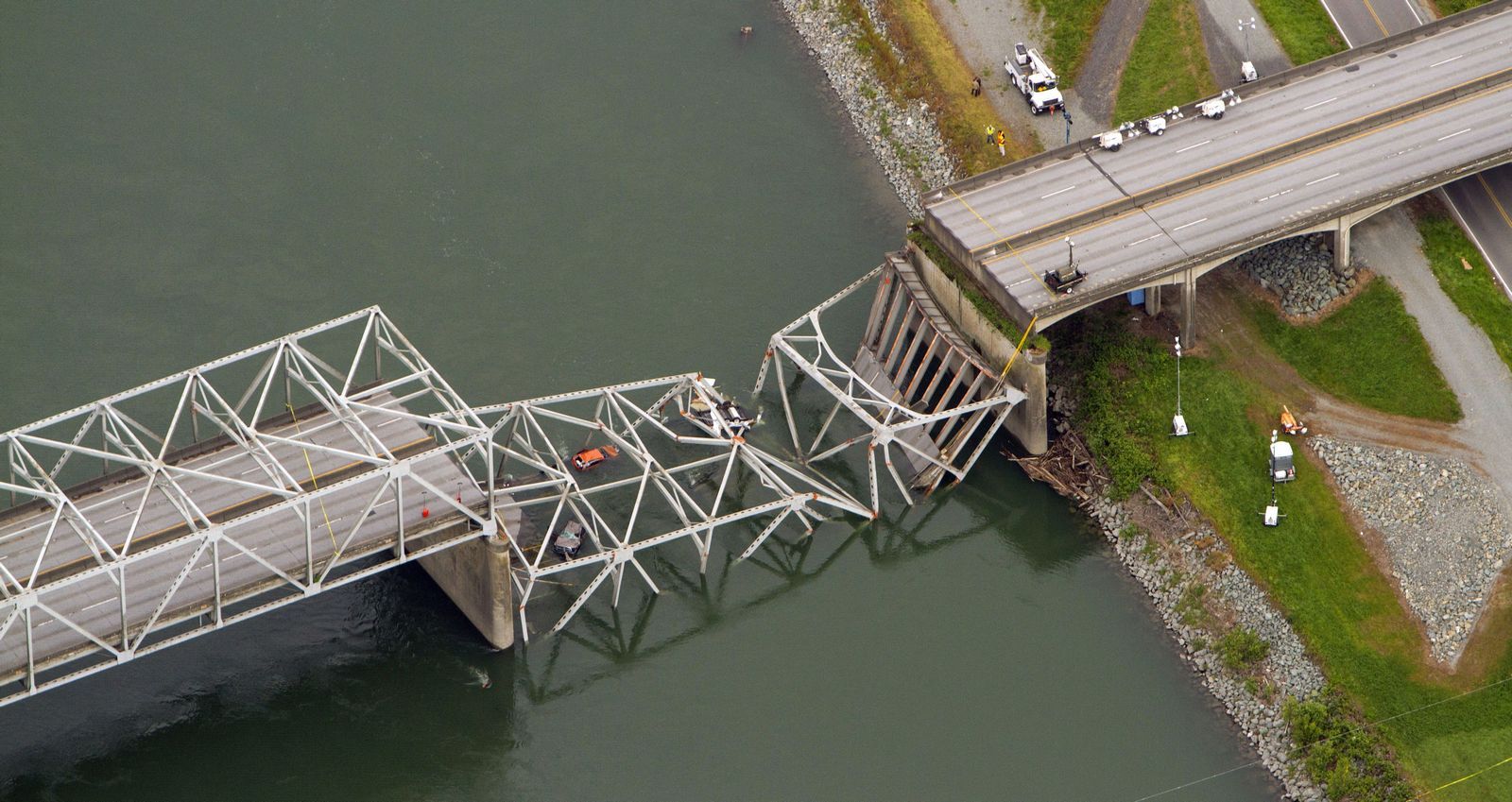 Associated PressA collapsed section of the I-5 bridge over the Skagit River is seen in an aerial view Friday. Part of the bridge collapsed Thursday evening, sending cars and people into the water when a an oversized truck hit the span.