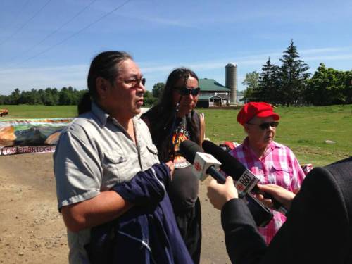 Representatives from Six Nations speak to reporters. “Enbridge is operating in our territory without any consultation with us, and that’s outrageous. We’re here for all people and their children – It’s not just native people anymore.” Photo: @AdamCarterCBC