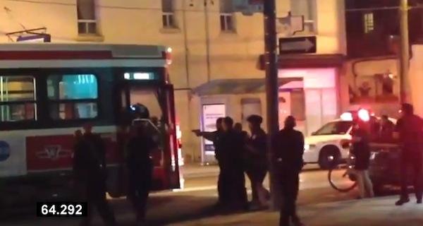 Video still/YouTubeToronto police surround, then open fire on, an empty streetcar in which an 18-year-old Syrian boy is brandishing a small knife. Sammy Yatim died of his wounds.