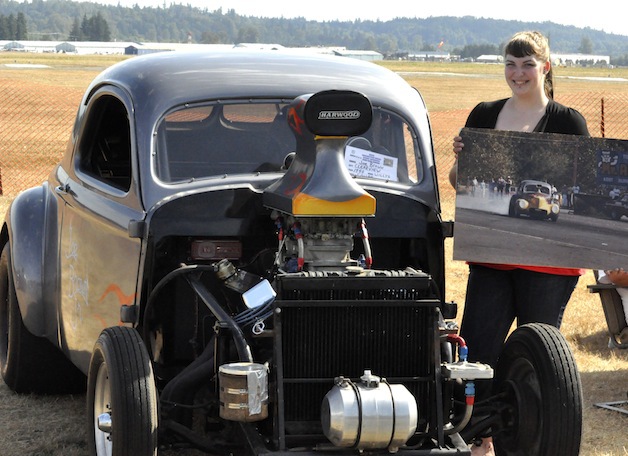 Rachel Brown showed off her father Joe Brown's 1940 Willys Coupe at last year's Drag Strip Reunion.— image credit: File photo.