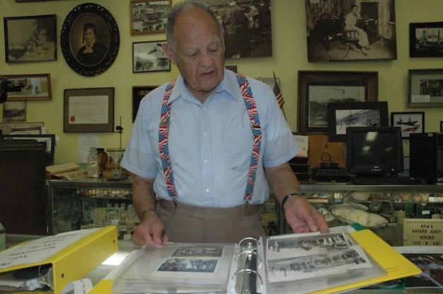 Kirk BoxleitnerMarysville Historical Society President Ken Cage peruses some of the books of old photos that will be on display for the public during the Marysville Street Festival: Handmade & Homegrown from Aug. 9-11.