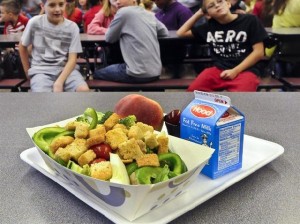 In this Tuesday, Sept. 11, 2012 file photo, a select healthy chicken salad school lunch, prepared under federal guidelines, sits on display at the cafeteria at Draper Middle School in Rotterdam, N.Y. After just one year, some schools across the nation are dropping out of what was touted as a healthier federal lunch program, complaining that so many students refused the meals packed with whole grains, fruits and vegetables that their cafeterias were losing money. (AP Photo/Hans Pennink, File)