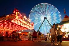 Mark Mulligan / The HeraldThe Giant Wheel lights up the midway as it rotates at the Evergreen State Fair in 2011.