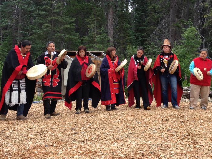 Members of the Wet'suwet'en nation perform a welcoming song to open the 4th annual Unis'tot'en action camp. Photo: Aaron Lakoff