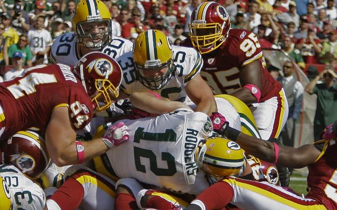 Rick WoodAaron Rodgers tries to cross the goal line in the Packers’ October 2010 road game loss against the Washington Redskins.