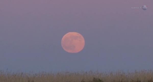 NASA/YouTubeThe harvest moon is giant and red upon the horizon because it rises at sunset.