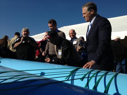 Credit Anna KingGovernor Jay Inslee signs his name to some of the pipe that will put water back in Manastash Creek near Ellensburg, Wash.