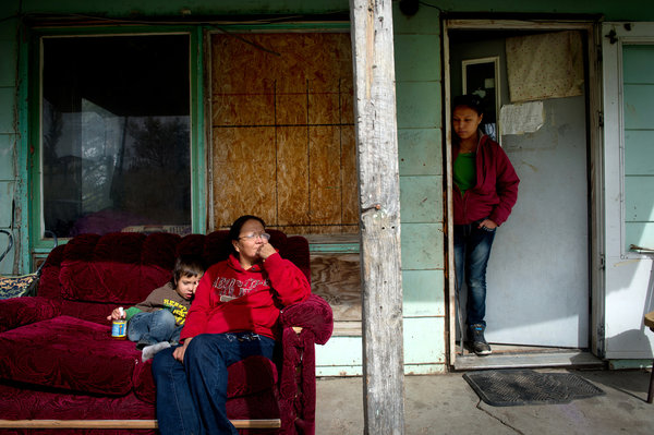 Rich Addicks for The New York TimesAudrey Costa at home on the Crow reservation in Montana with her grandson Benjamin Costa and her daughter, Beth Dawes, right. Ms. Costa has not received her federal lease payment. 