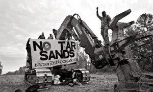 Activists with Tar Sands Blockade lock themselves to equipment used to build the Keystone XL pipeline, near Nacogdoches, Texas, November 19, 2012. Photo: Elizabeth Brossa