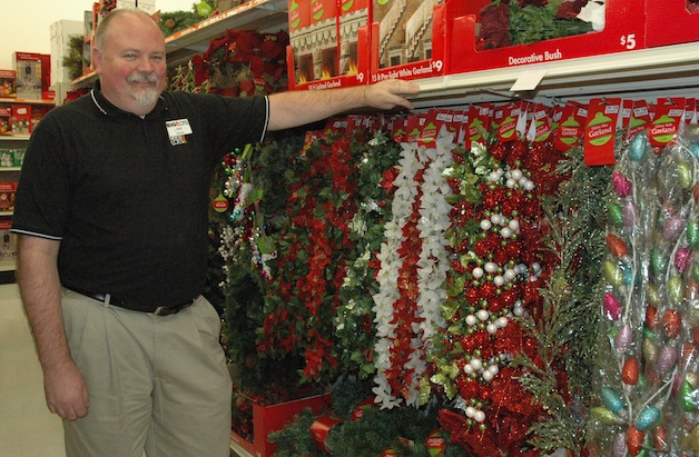 Marysville Big Lots Store Manager Dan Hanlon shows off the store’s seasonal stock, ready to help shoppers get into the holiday spirit.— image credit: Kirk Boxleitner